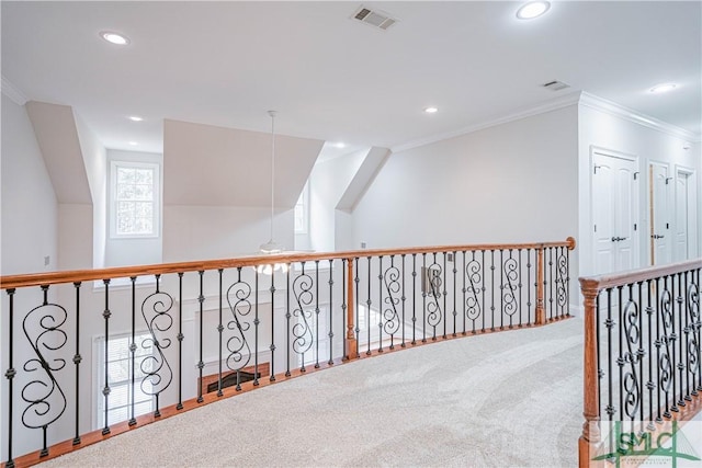 corridor with carpet flooring and ornamental molding