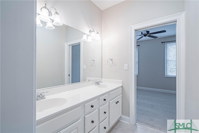 bathroom with tile patterned floors, vanity, and ceiling fan