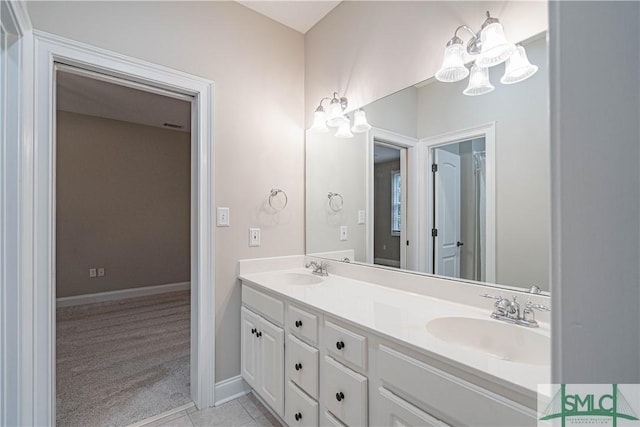 bathroom with tile patterned flooring and vanity