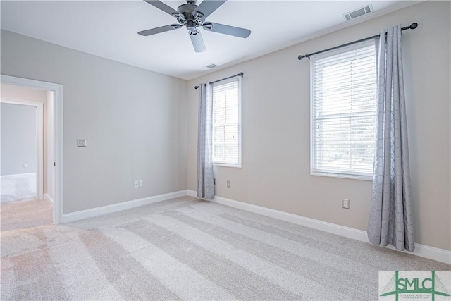 empty room with light carpet and ceiling fan