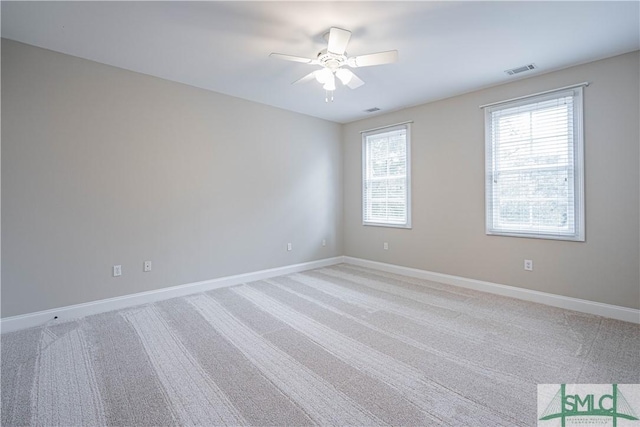 unfurnished room with carpet flooring and ceiling fan