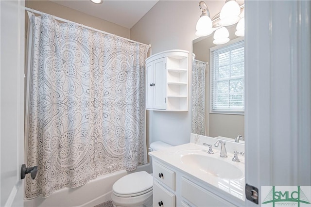 full bathroom featuring a notable chandelier, vanity, toilet, and shower / tub combo