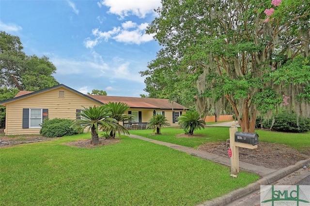 ranch-style house with a front lawn