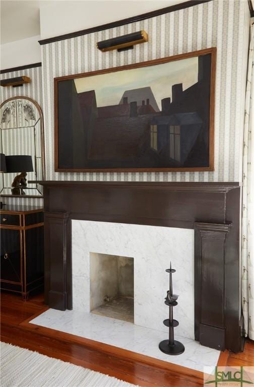 room details featuring a high end fireplace and hardwood / wood-style flooring