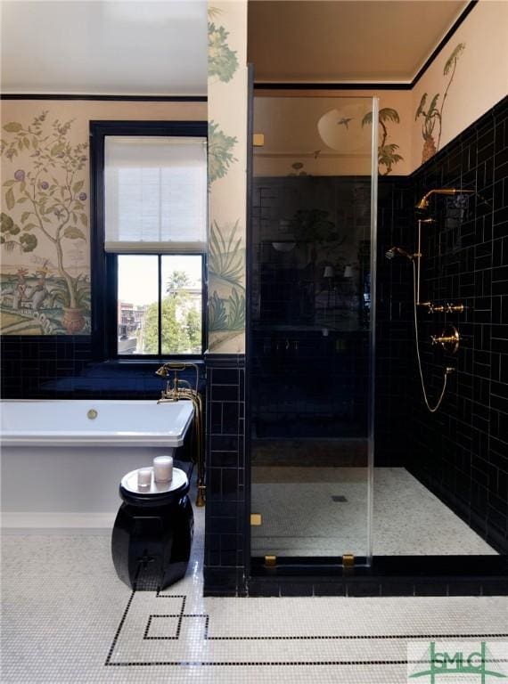 bathroom featuring tile patterned floors and independent shower and bath