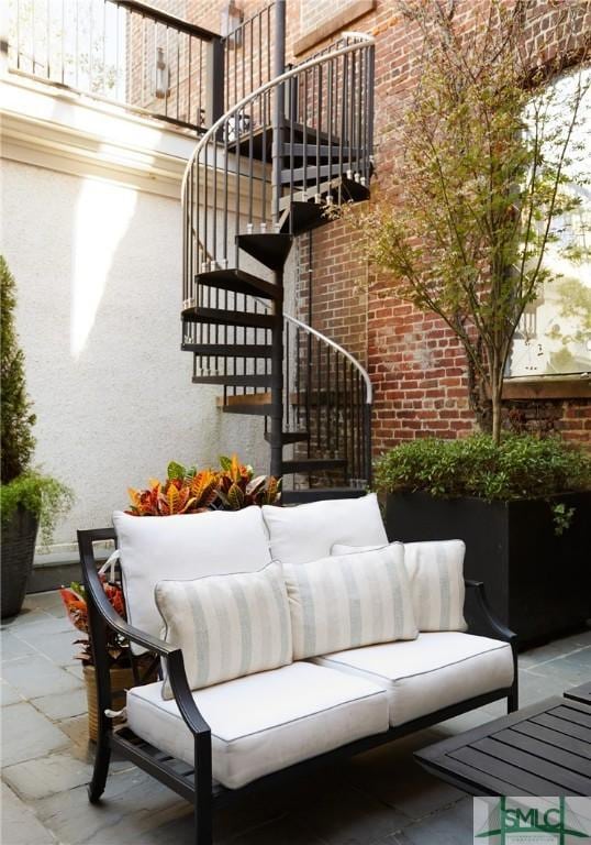 exterior space featuring an outdoor living space and a balcony