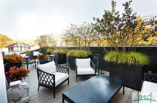 wooden deck with an outdoor living space