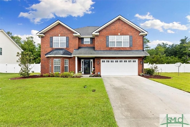 view of front of property with a front lawn and a garage