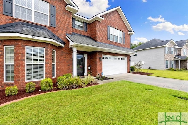 view of front of house with a garage and a front yard