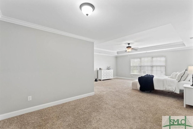 bedroom with ceiling fan, carpet floors, ornamental molding, and a raised ceiling