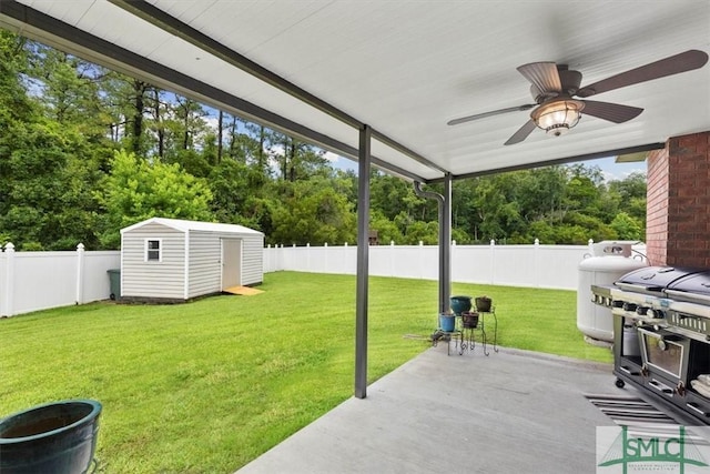 view of patio / terrace featuring grilling area, ceiling fan, and a shed