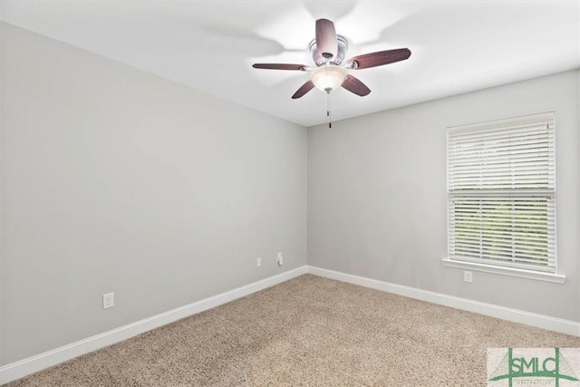 unfurnished room with ceiling fan and carpet flooring