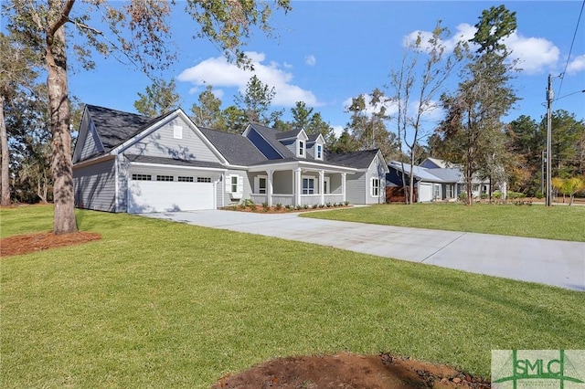 cape cod home featuring a garage and a front yard