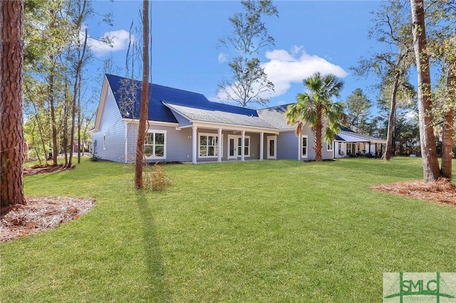 rear view of house with a lawn