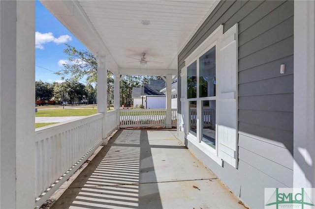 view of patio featuring ceiling fan and a porch