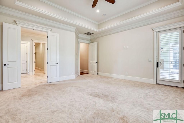 unfurnished bedroom with crown molding, light colored carpet, and ceiling fan