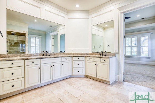 bathroom featuring vanity, an enclosed shower, crown molding, and tile patterned flooring