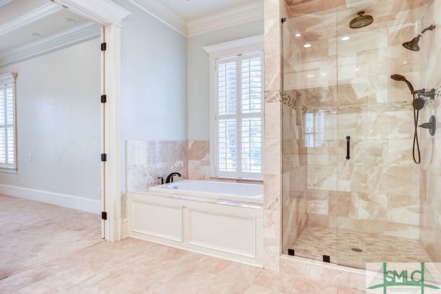 bathroom featuring ornamental molding and separate shower and tub