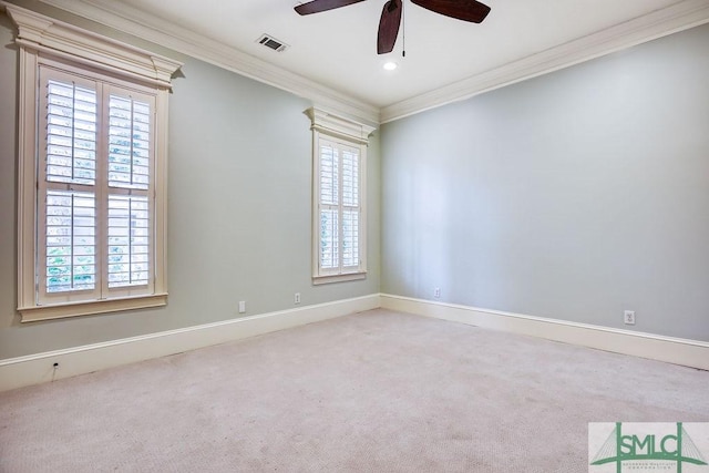 unfurnished room with crown molding, ceiling fan, and carpet flooring