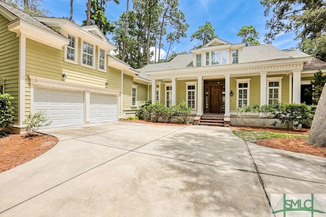 view of front of house featuring a garage and covered porch