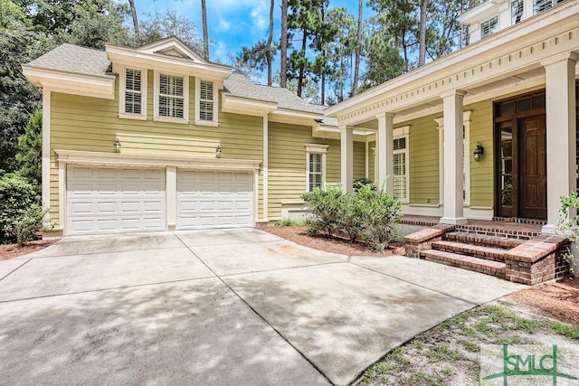 view of front of property featuring a garage and covered porch