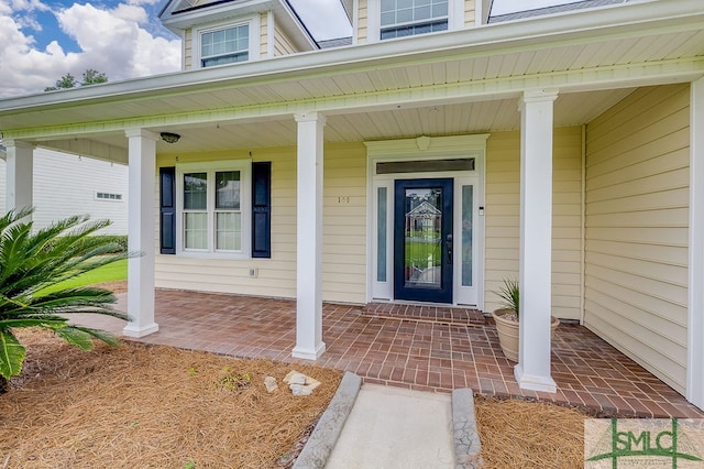 property entrance featuring covered porch