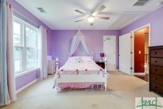 carpeted bedroom with multiple windows and ceiling fan