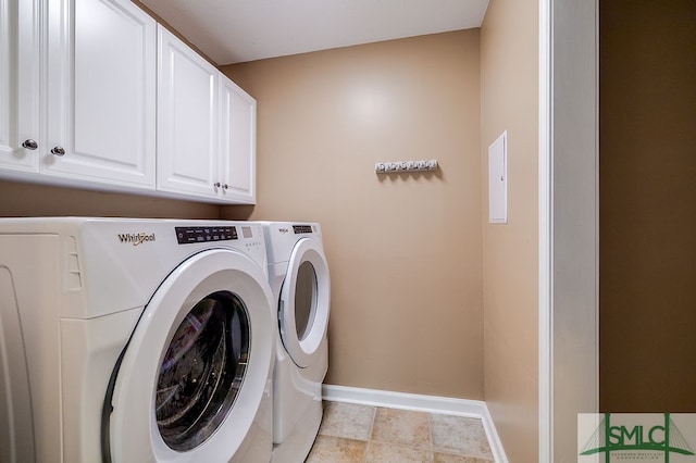 laundry room with washer and dryer, cabinets, and light tile patterned floors