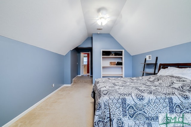 carpeted bedroom with lofted ceiling and ceiling fan