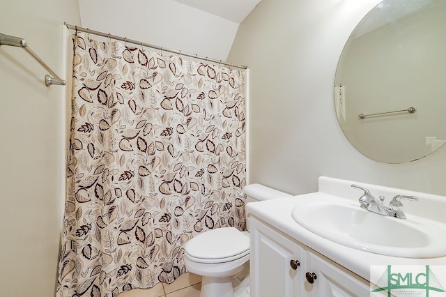 bathroom featuring vanity, tile patterned flooring, and toilet