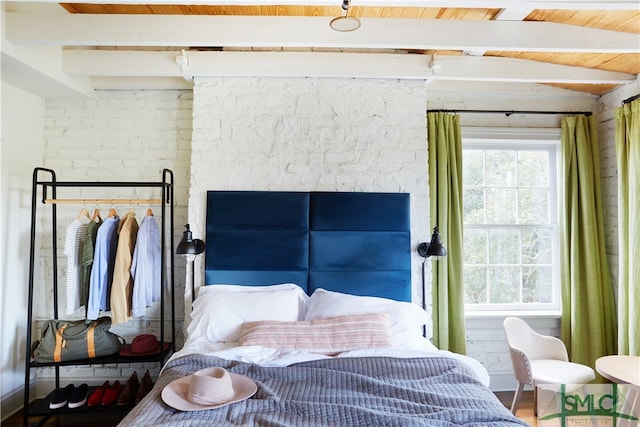 interior space featuring vaulted ceiling with beams, wood ceiling, and wood-type flooring