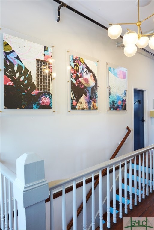 stairs with hardwood / wood-style floors