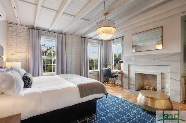 bedroom with beamed ceiling, a notable chandelier, and parquet floors