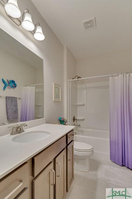 full bathroom with tile patterned flooring, vanity, shower / bath combination with curtain, and toilet