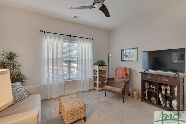 living room featuring ceiling fan and carpet floors