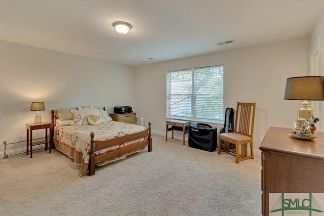 bedroom featuring light colored carpet