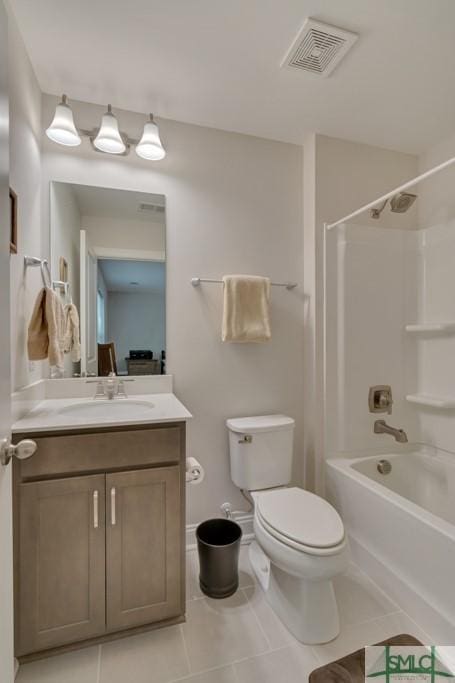 full bathroom featuring tile patterned floors, vanity, toilet, and shower / tub combination