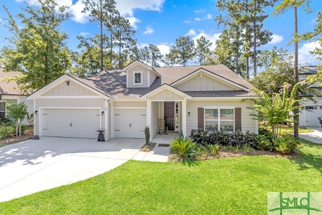 view of front of property with a front lawn, concrete driveway, board and batten siding, and an attached garage