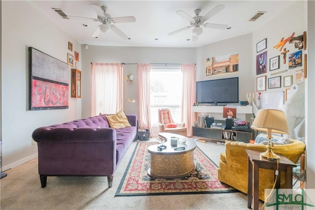 living room featuring carpet and ceiling fan