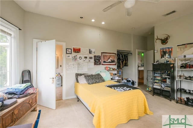 carpeted bedroom with a closet and ceiling fan