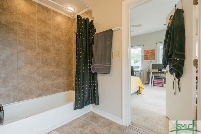 bathroom featuring shower / bathtub combination with curtain and tile patterned floors