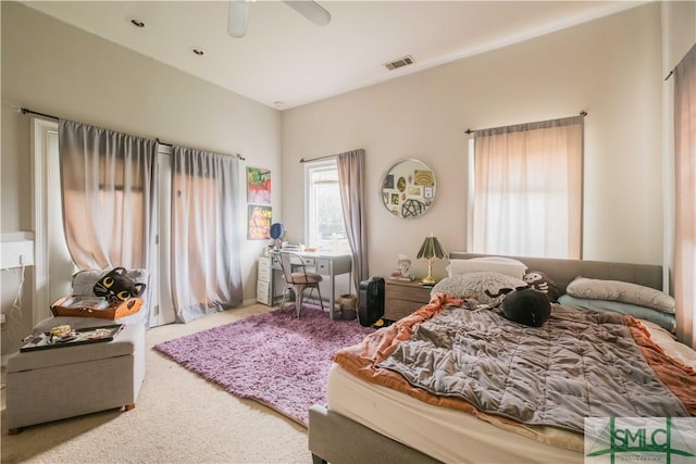 carpeted bedroom with ceiling fan