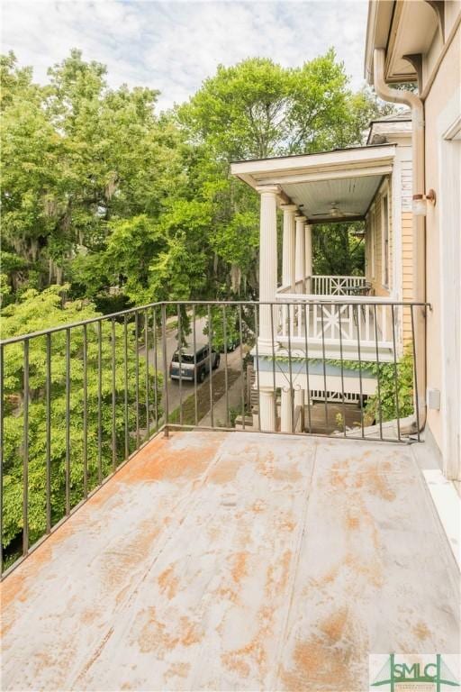 view of patio featuring a balcony