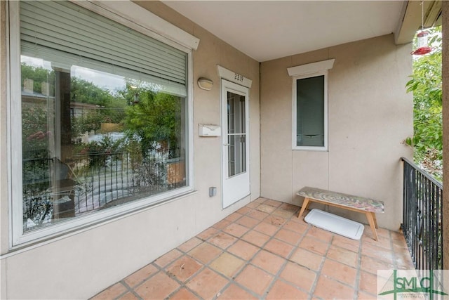 view of patio featuring a balcony