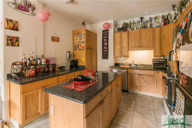 kitchen with sink, a center island, a textured ceiling, dark stone countertops, and stainless steel dishwasher