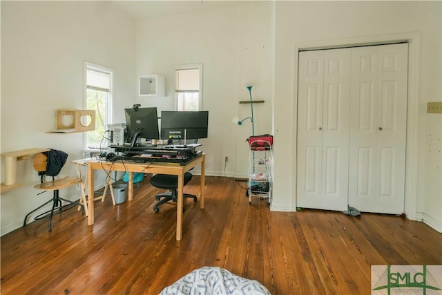 office with dark hardwood / wood-style floors