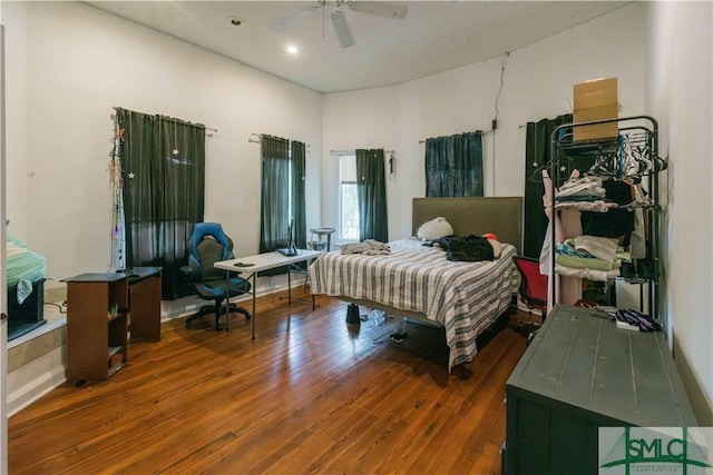 bedroom featuring dark hardwood / wood-style flooring and ceiling fan