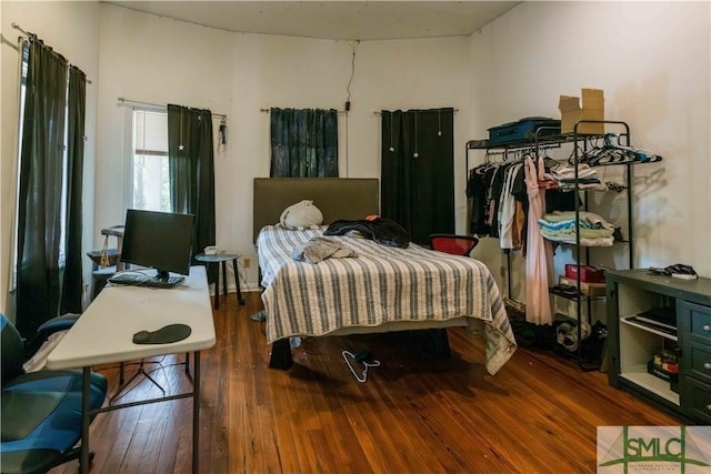 bedroom featuring dark wood-type flooring