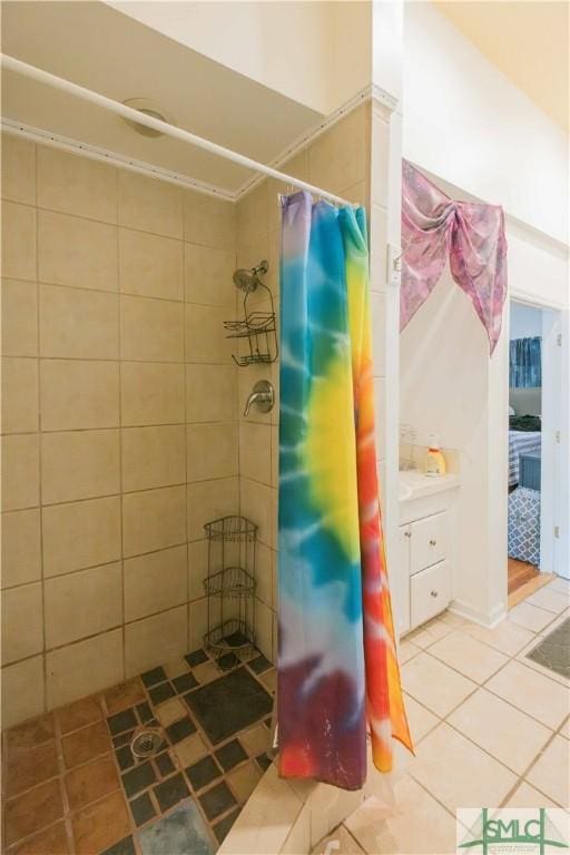 bathroom with tile patterned flooring and walk in shower