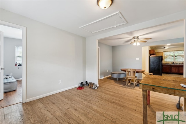 interior space with ceiling fan and hardwood / wood-style floors